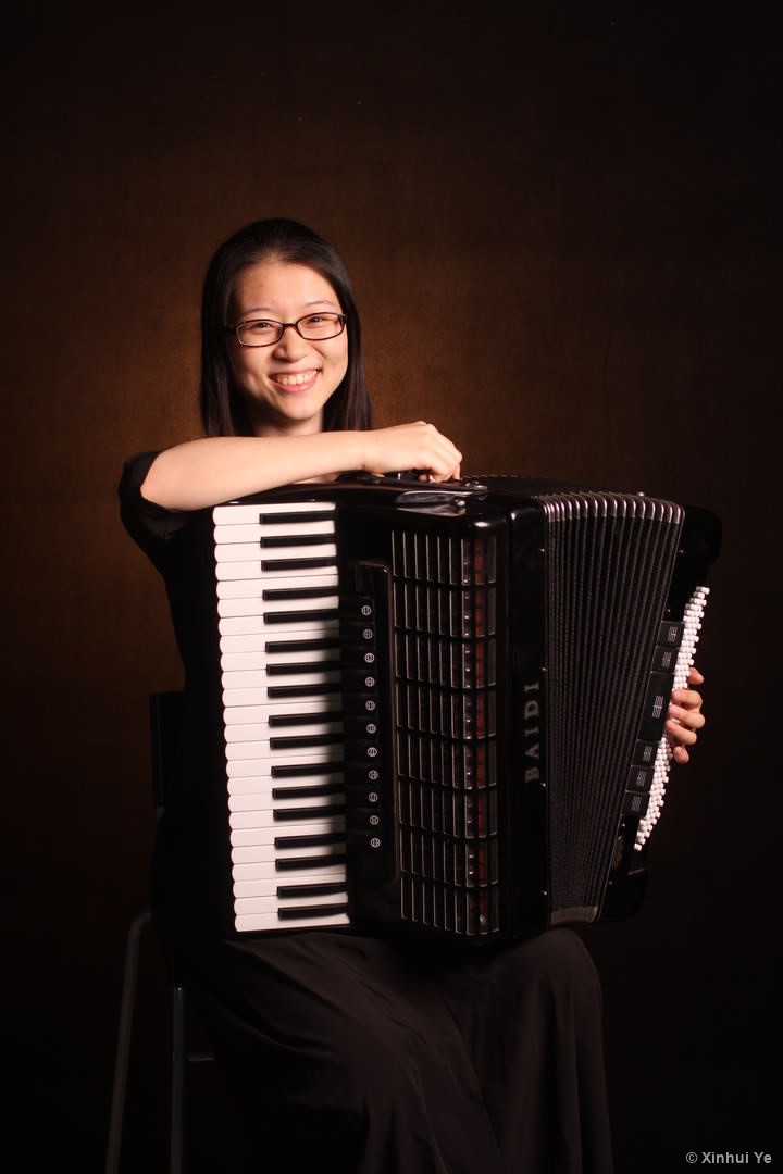 Xinhui playing the accordion