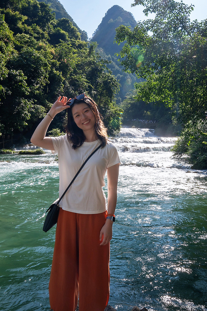 Xinhui Ye by a waterfall