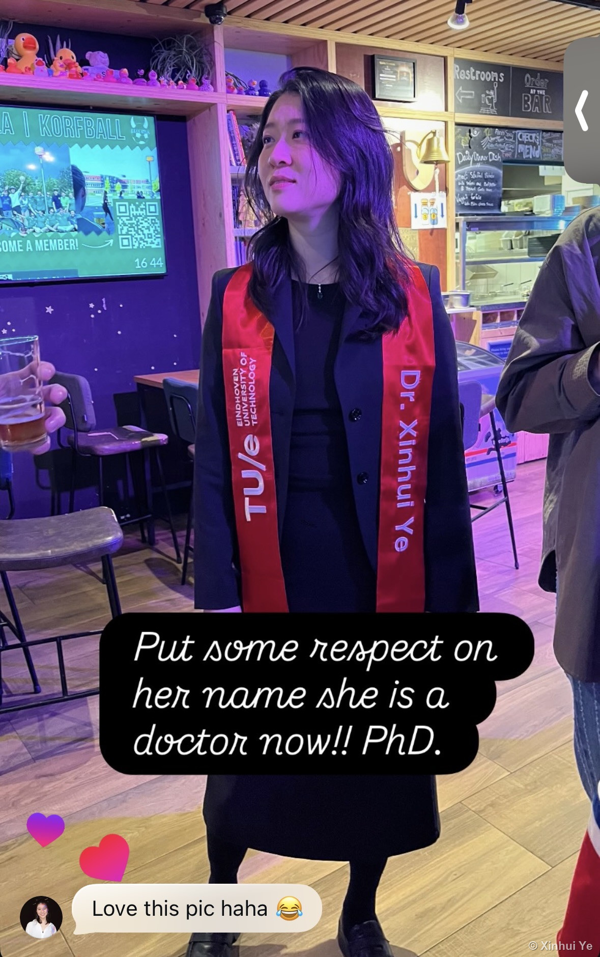 Celebrating at Hubble wearing a custom 'Dr. Xinhui Ye' sash
